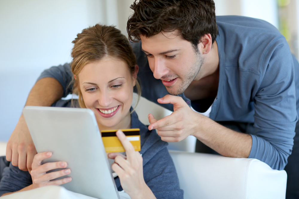 A man and woman shopping online
