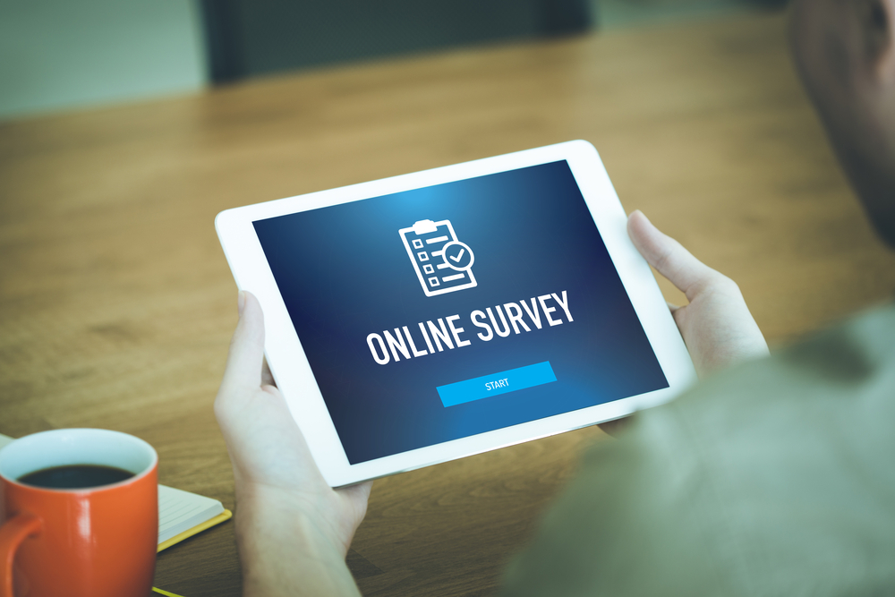 "Online survey" flashed on a tablet screen