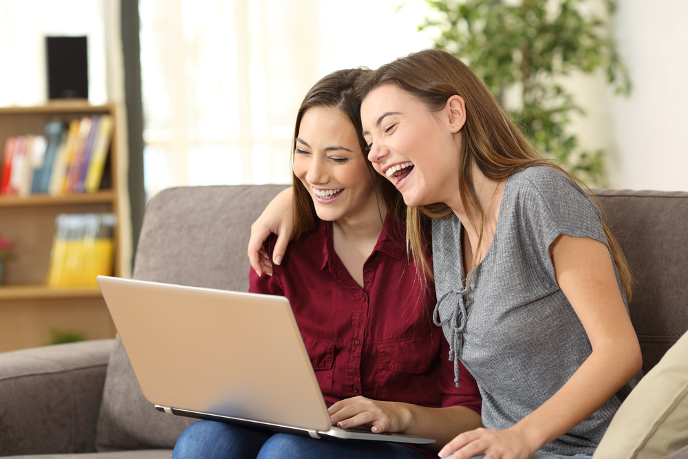Two young women on a laptop